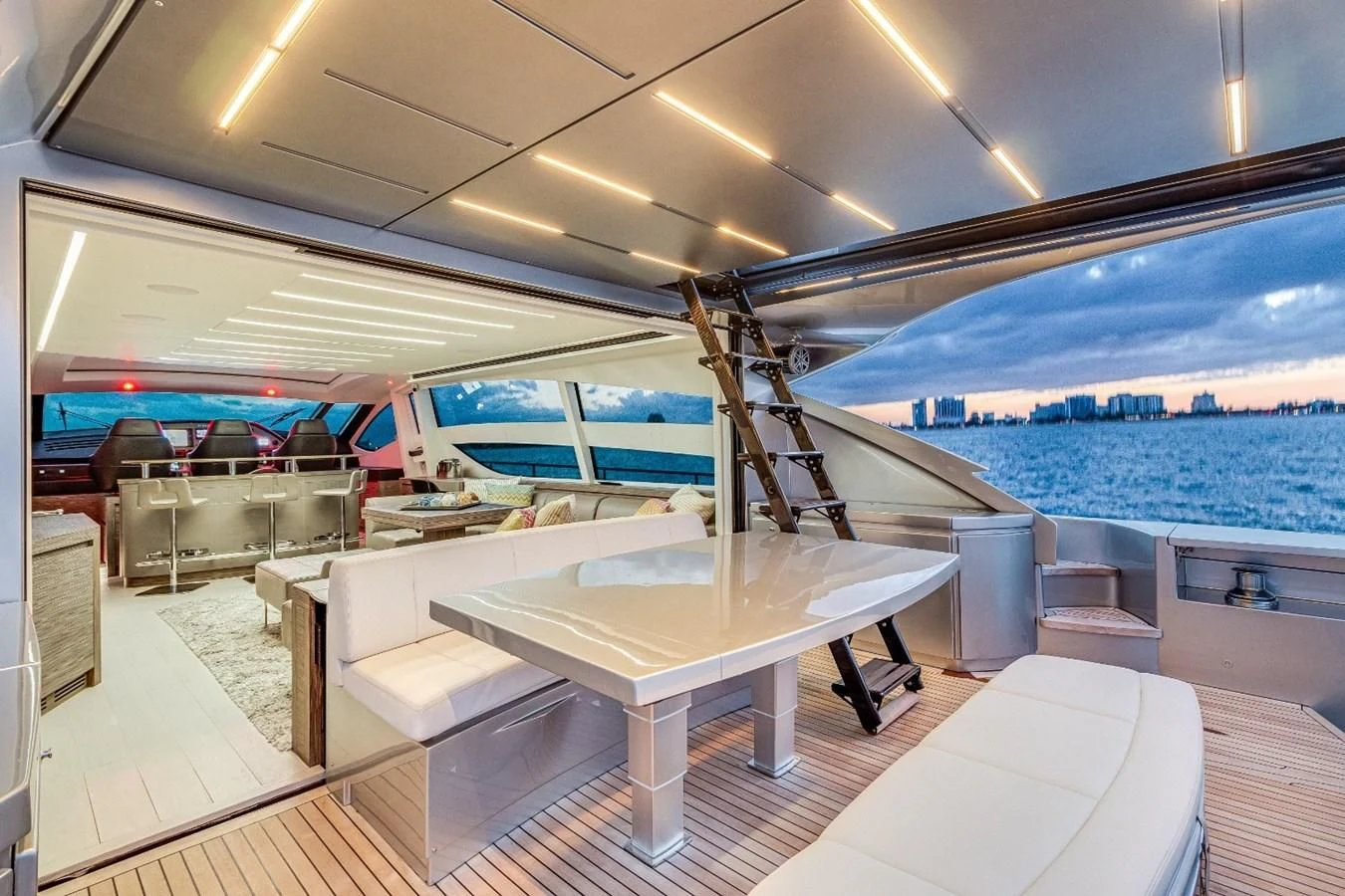 a room with a pool table and chairs aboard SUGAR Yacht for Sale