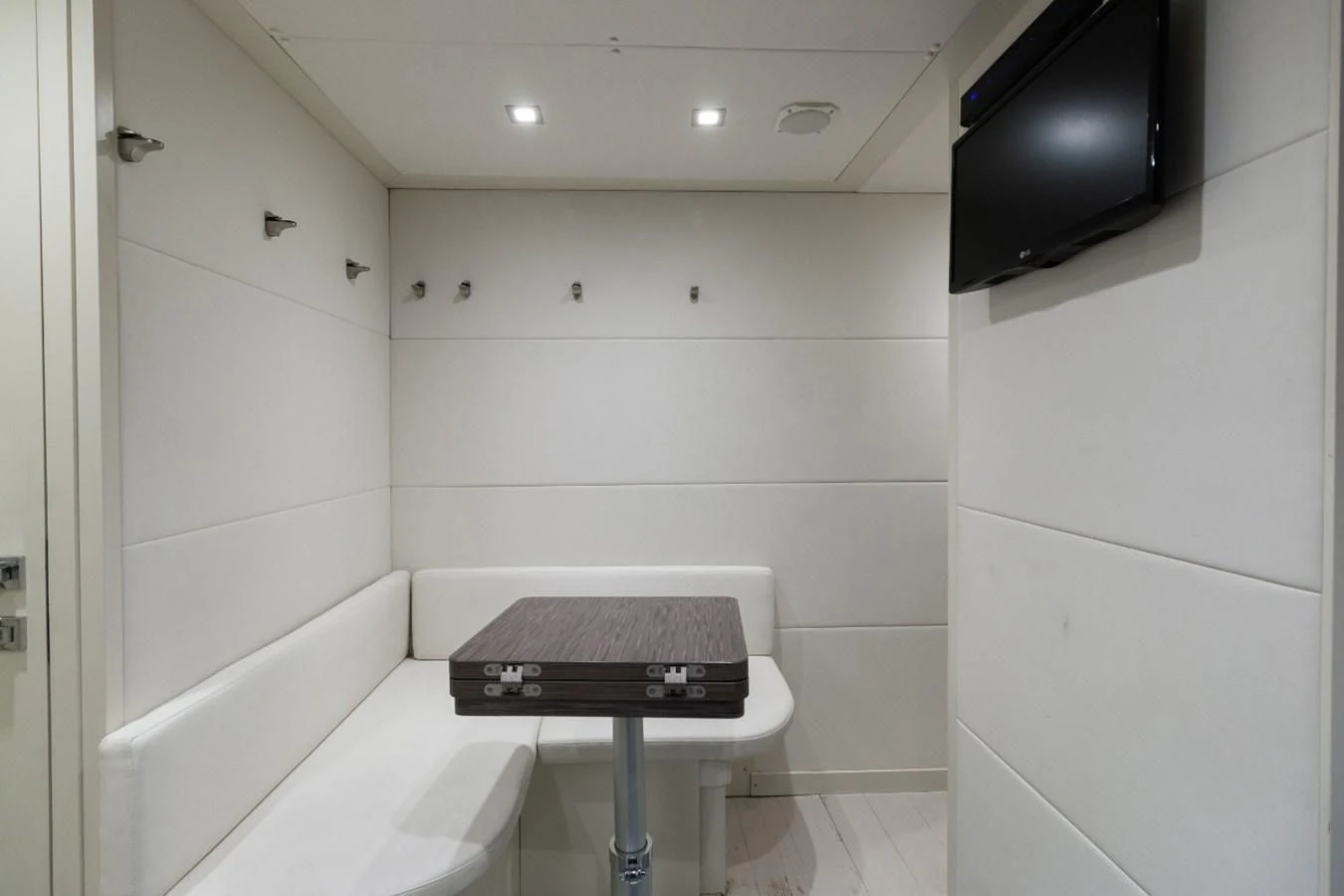 a room with a tv and a bathtub aboard SUGAR Yacht for Sale