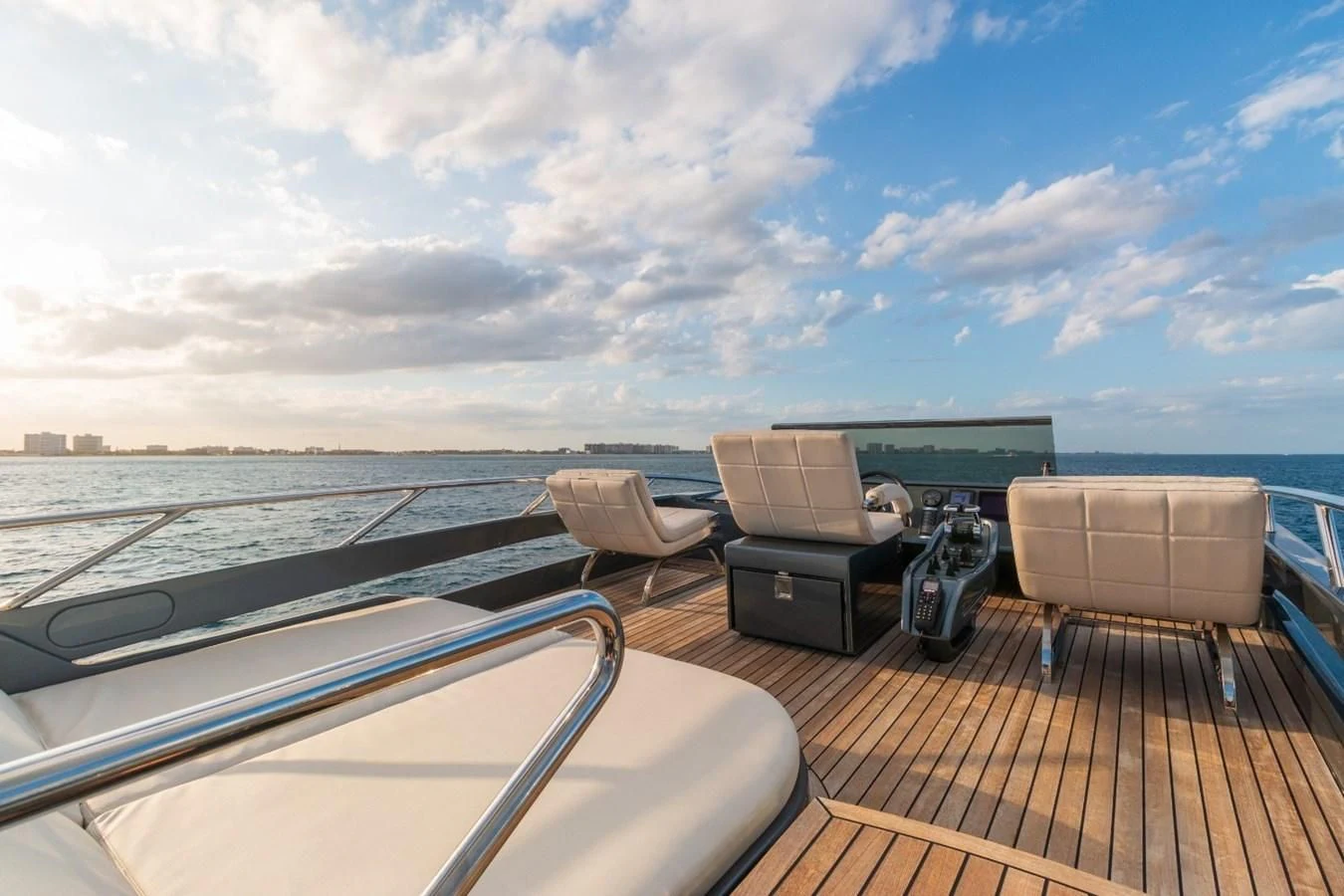 a deck with a deck and a view of the water aboard SUGAR Yacht for Sale