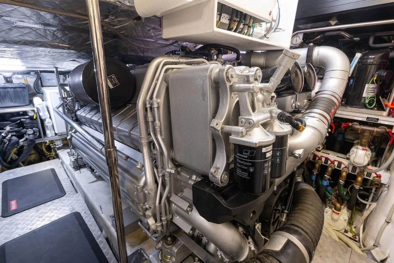 a car with a large engine aboard SUGAR Yacht for Sale