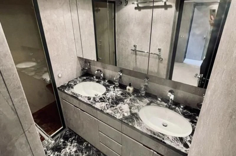 a bathroom with two sinks aboard DARK KNIGHT Yacht for Sale