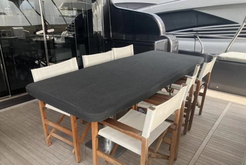 a chair on a table aboard DARK KNIGHT Yacht for Sale
