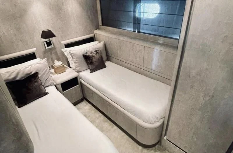 a bed in a room aboard DARK KNIGHT Yacht for Sale