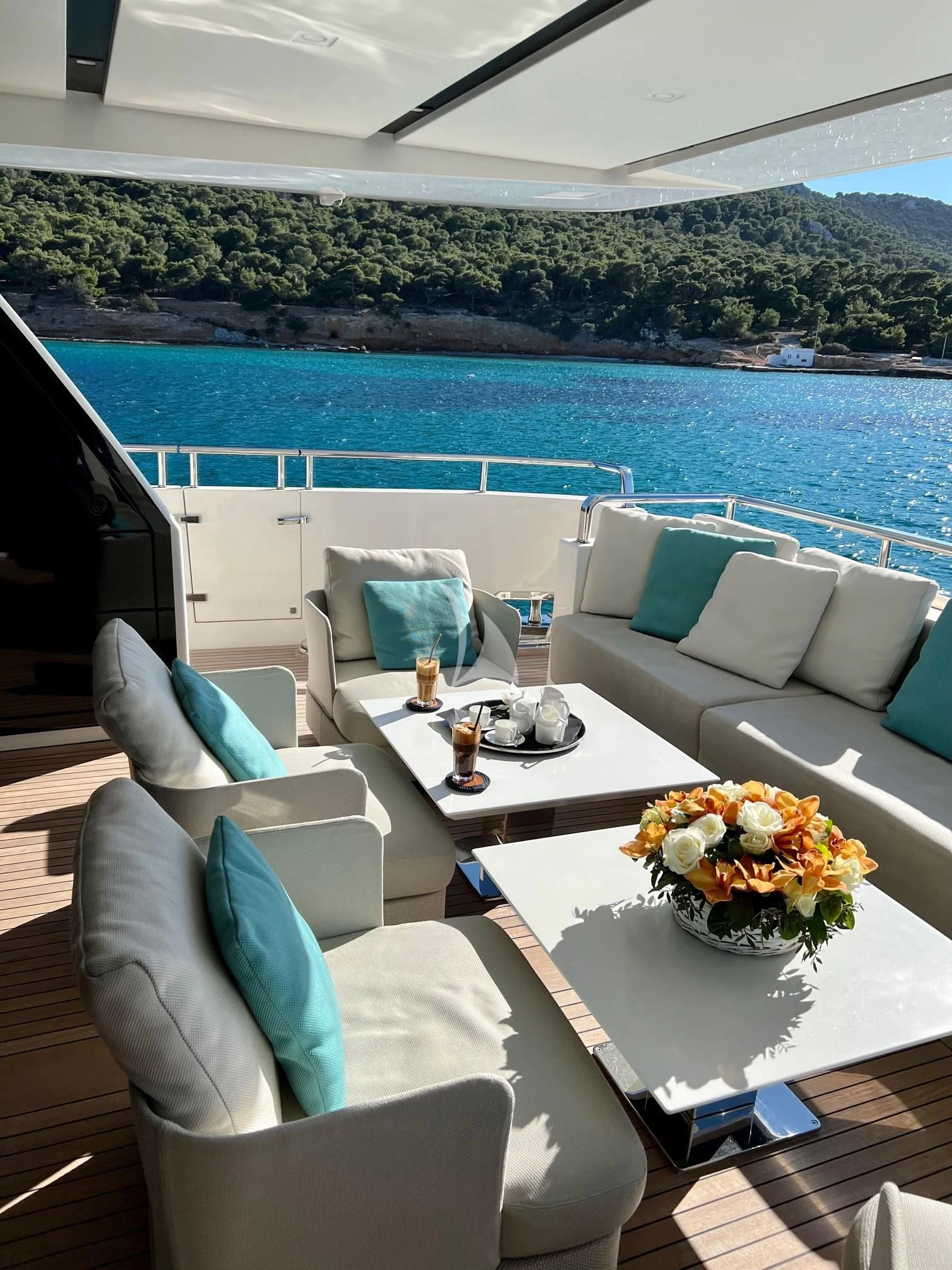 a room with a table chairs and a view of the ocean aboard DE ZEUS Yacht for Sale