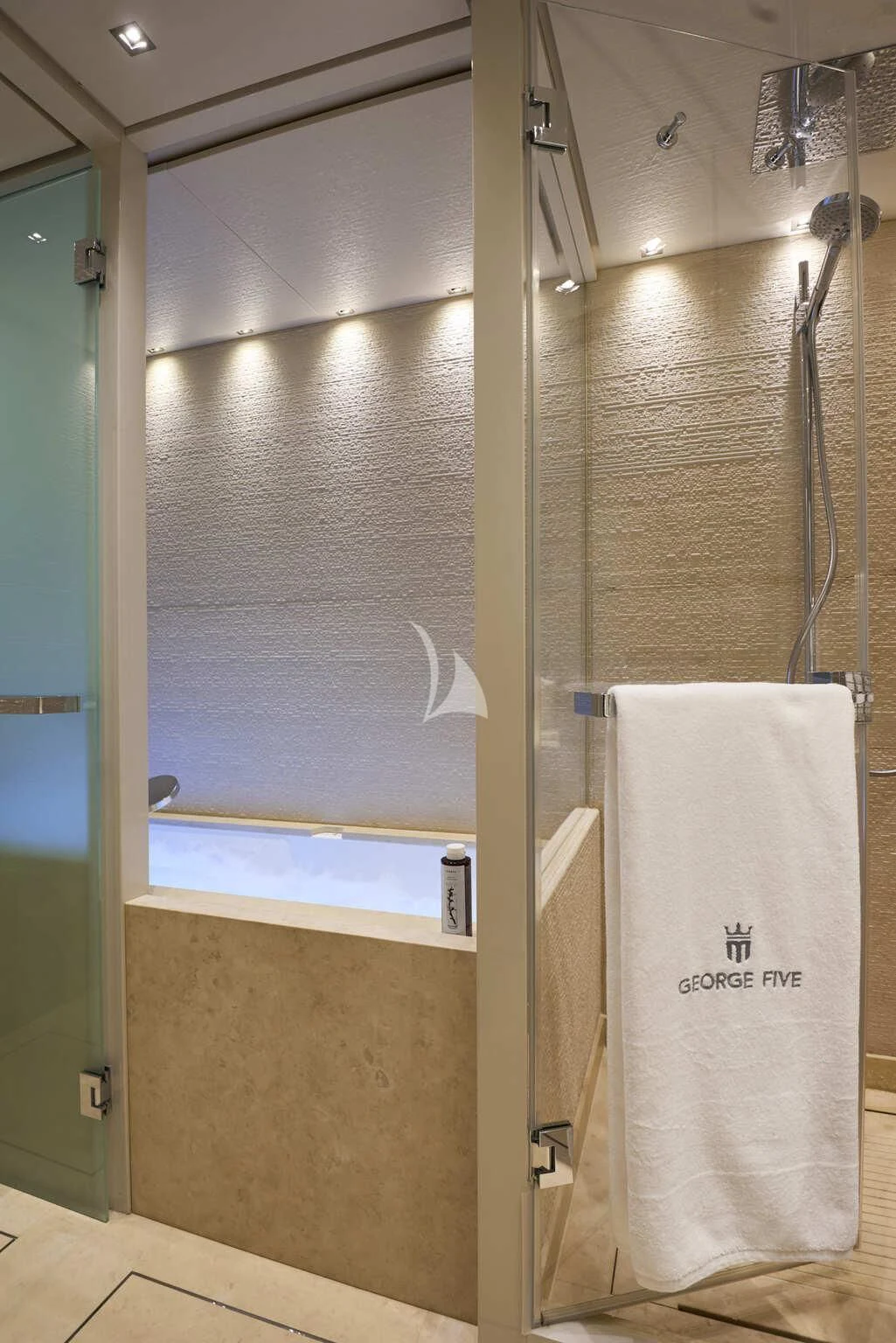 a shower unit with a towel on the wall aboard DE ZEUS Yacht for Sale