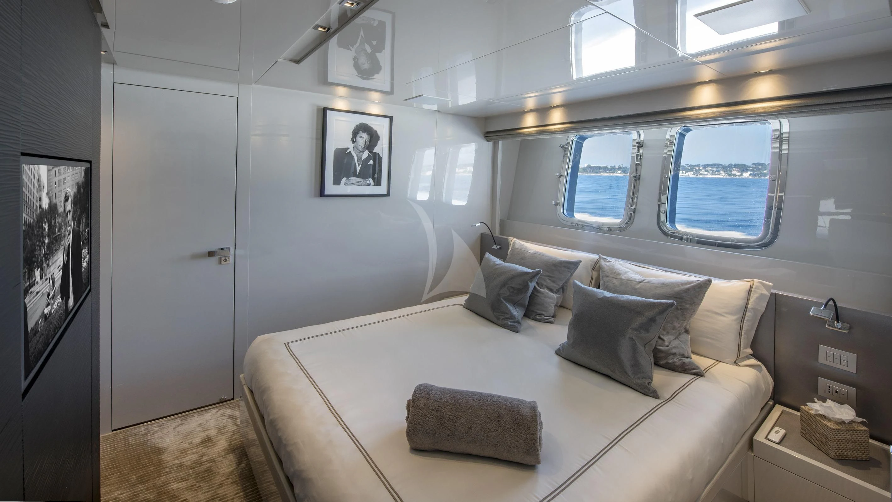 a bed with a white couch aboard DE ZEUS Yacht for Sale