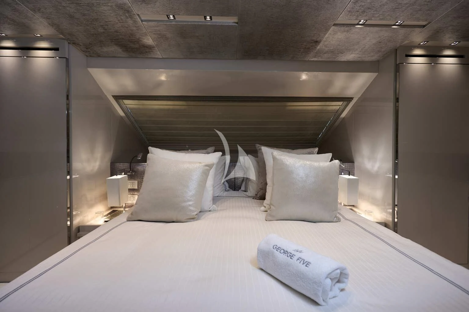 a bed with white sheets and pillows aboard DE ZEUS Yacht for Sale