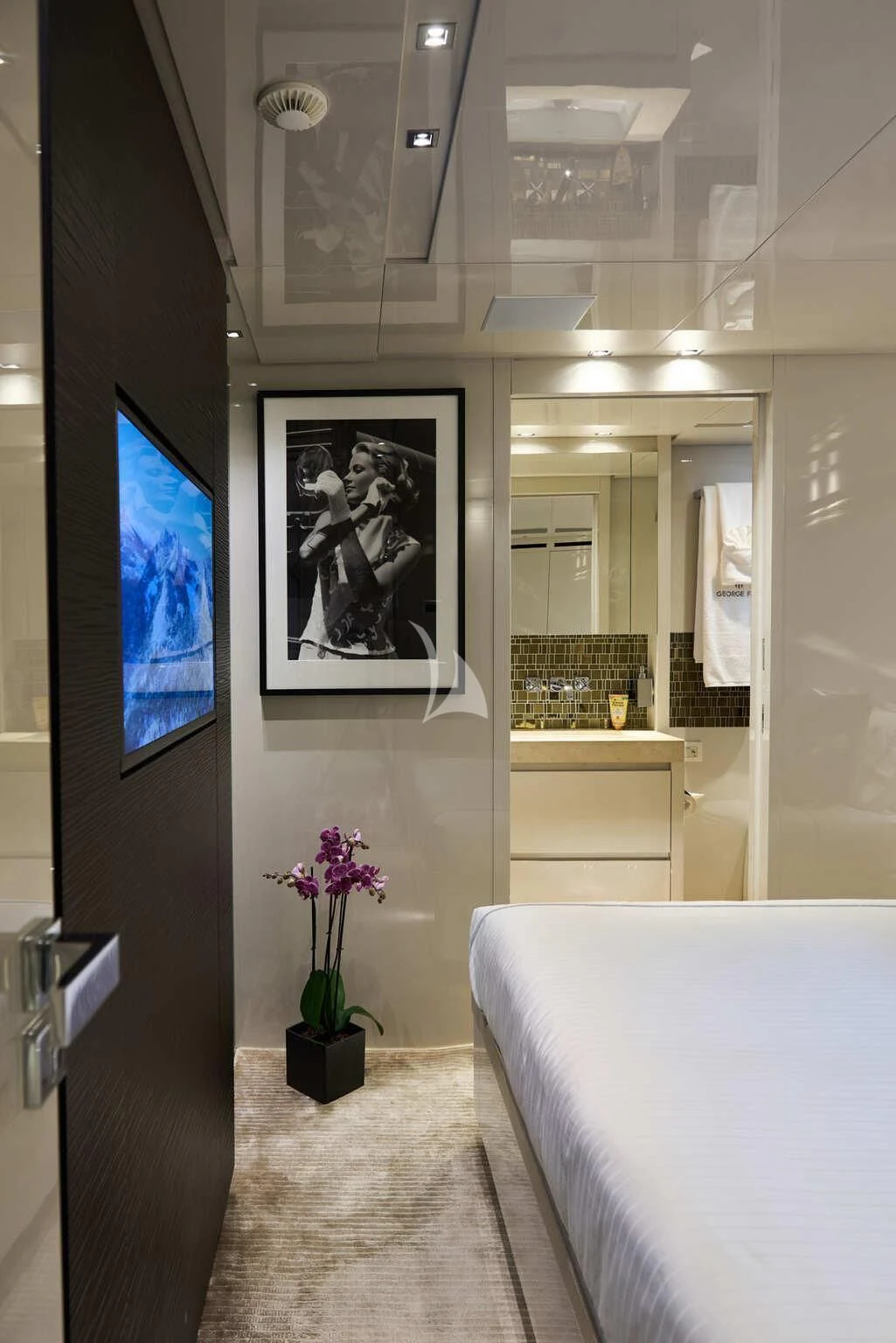 a room with a bed and a picture on the wall aboard DE ZEUS Yacht for Sale