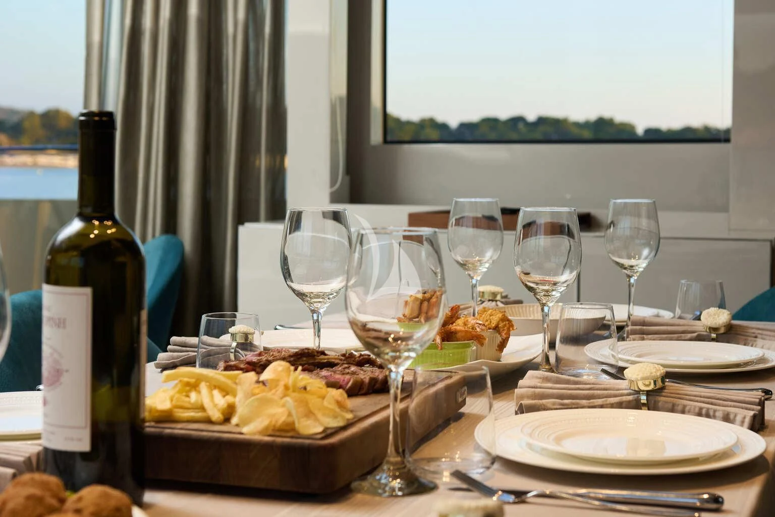 a table with food and wine aboard DE ZEUS Yacht for Sale