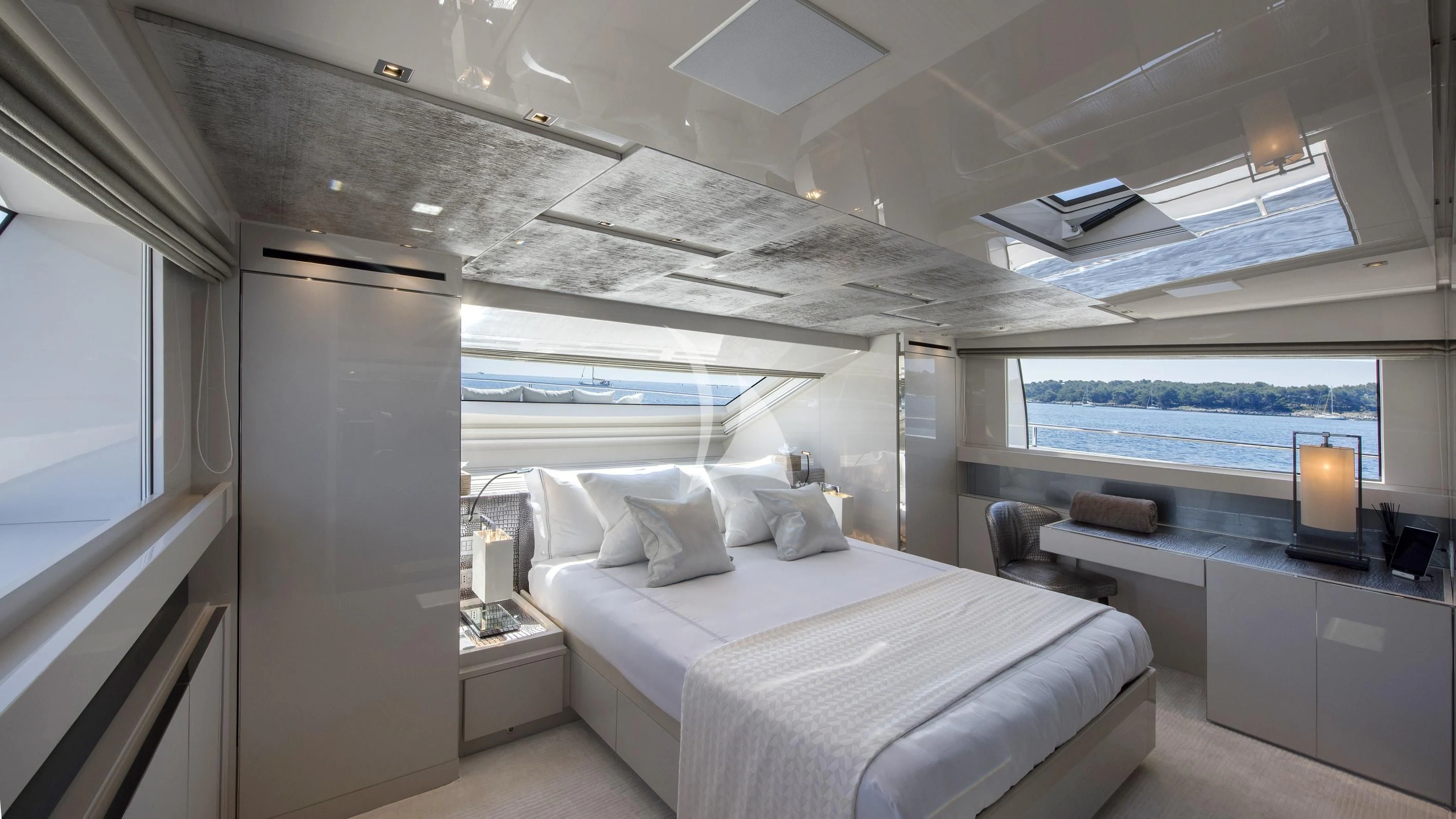 a room with a bed and a window aboard DE ZEUS Yacht for Sale