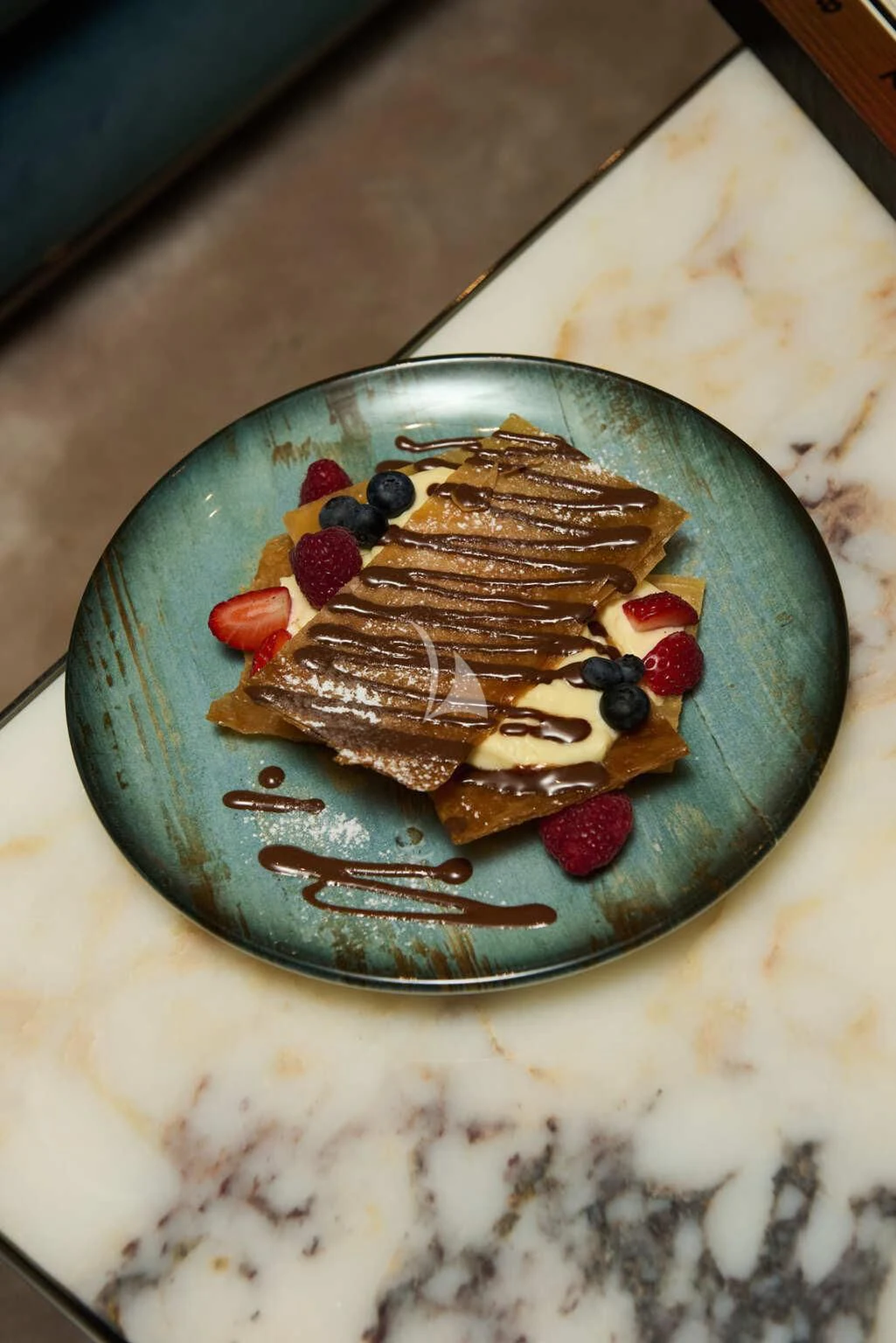 a plate of dessert aboard DE ZEUS Yacht for Sale
