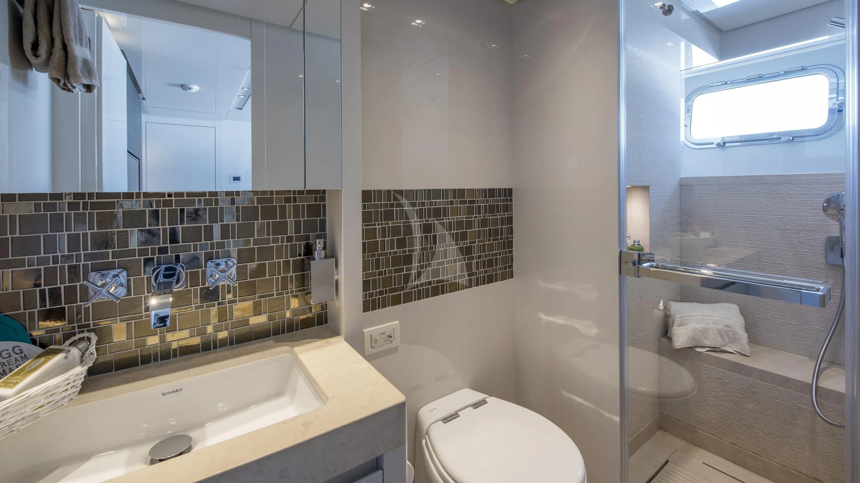 a bathroom with a glass shower aboard DE ZEUS Yacht for Sale