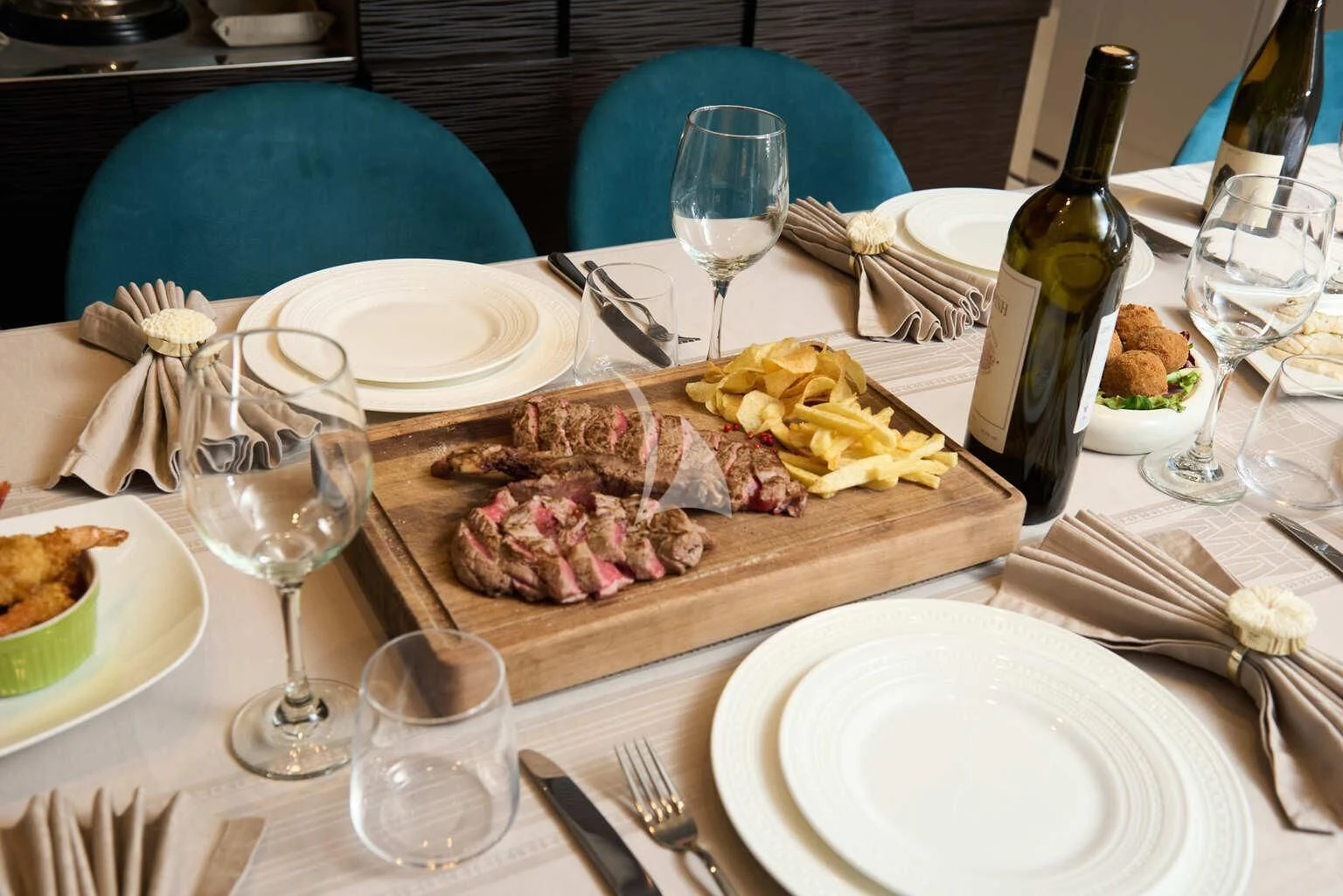 a table with food and wine aboard DE ZEUS Yacht for Sale