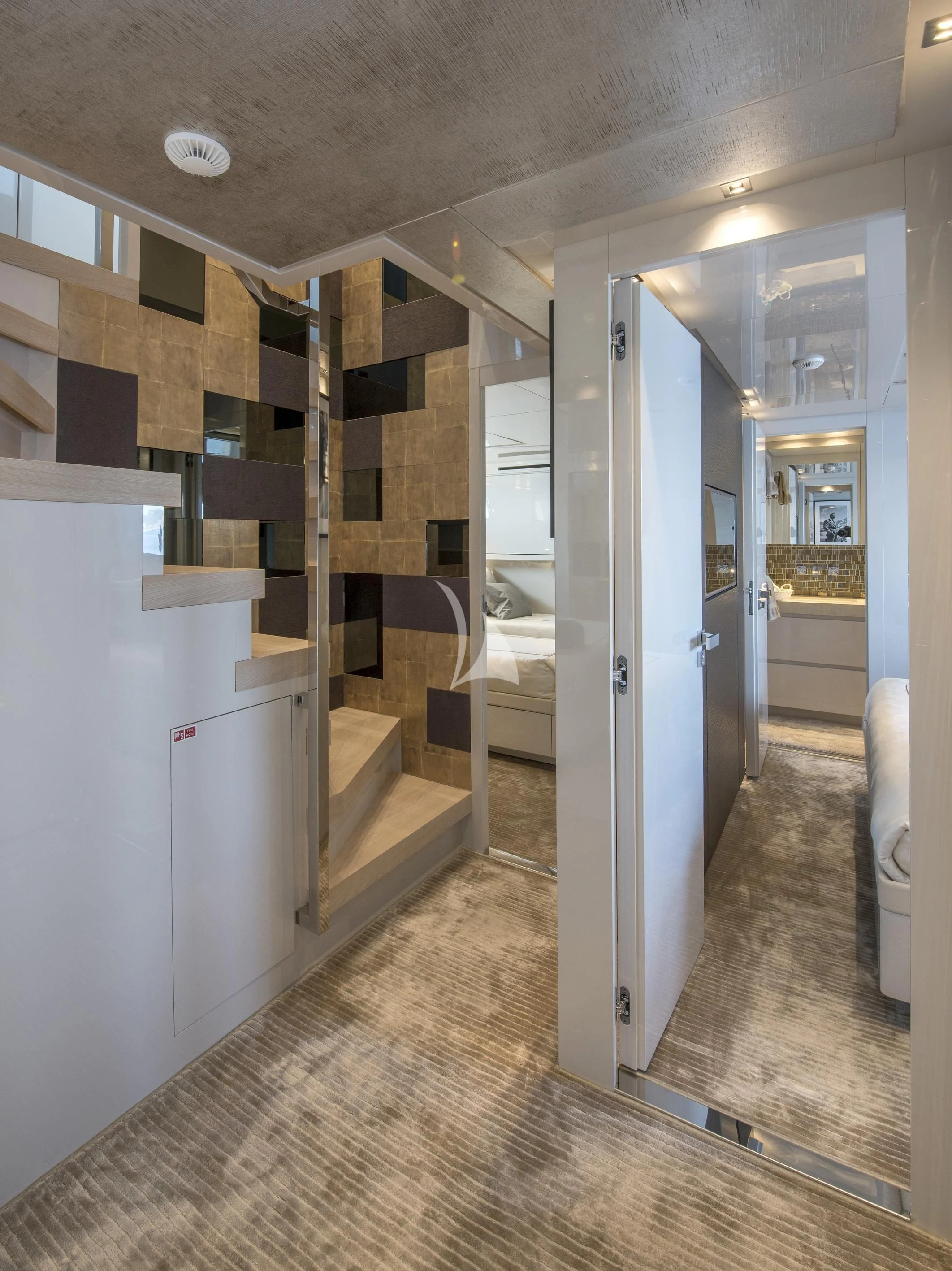 a hallway with a door and a mirror aboard DE ZEUS Yacht for Sale