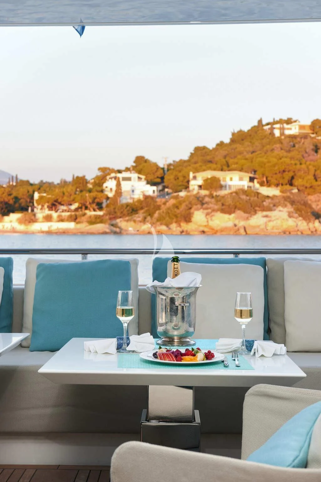 a table with food and wine glasses on it aboard DE ZEUS Yacht for Sale