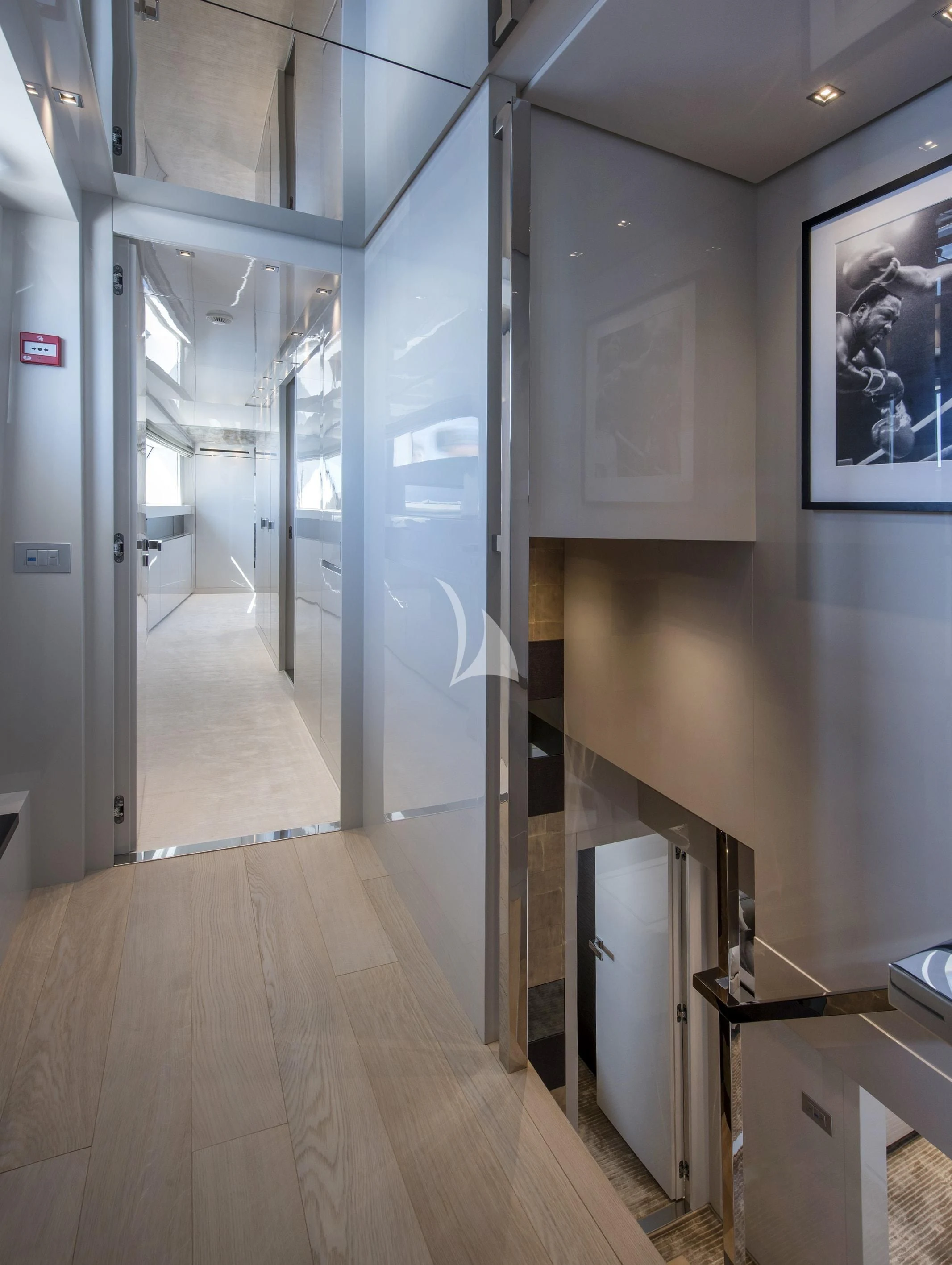 a hallway with glass doors aboard DE ZEUS Yacht for Sale