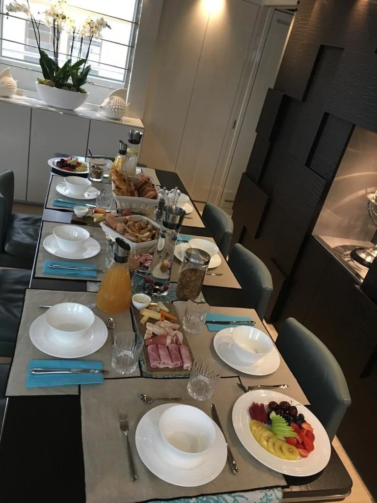 a table with plates and glasses aboard DE ZEUS Yacht for Sale