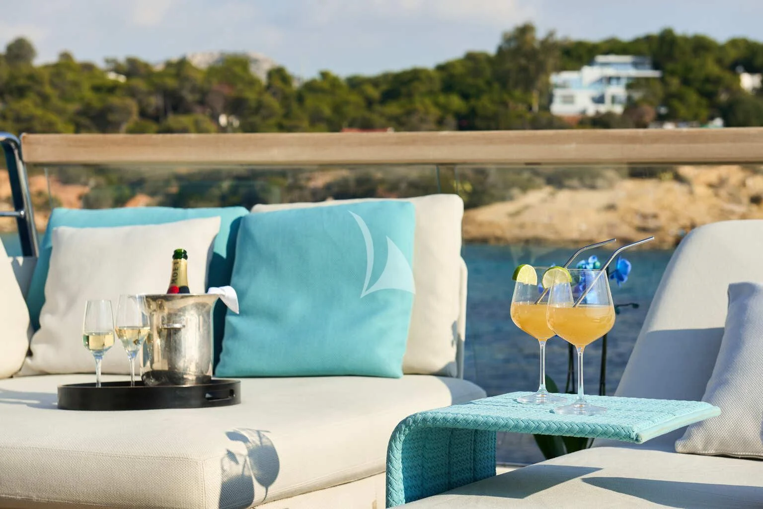a table with glasses and a plate with food on it aboard DE ZEUS Yacht for Sale