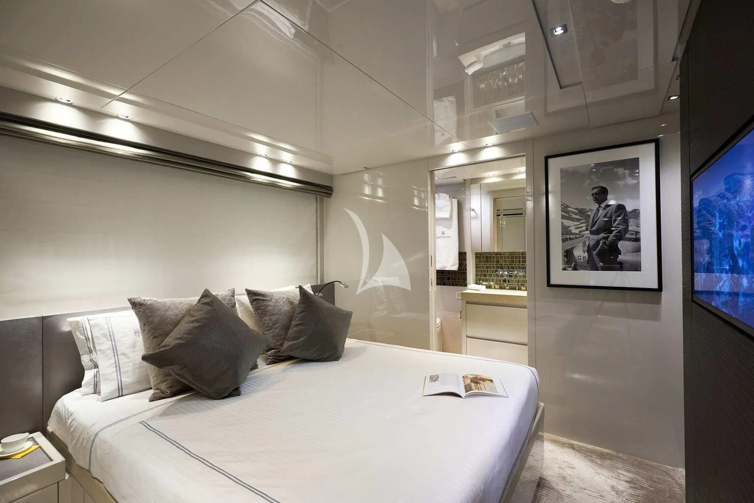 a bedroom with a bed and a mirror aboard DE ZEUS Yacht for Sale