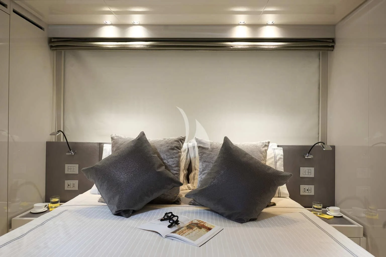 a bed with a white bed spread aboard DE ZEUS Yacht for Sale