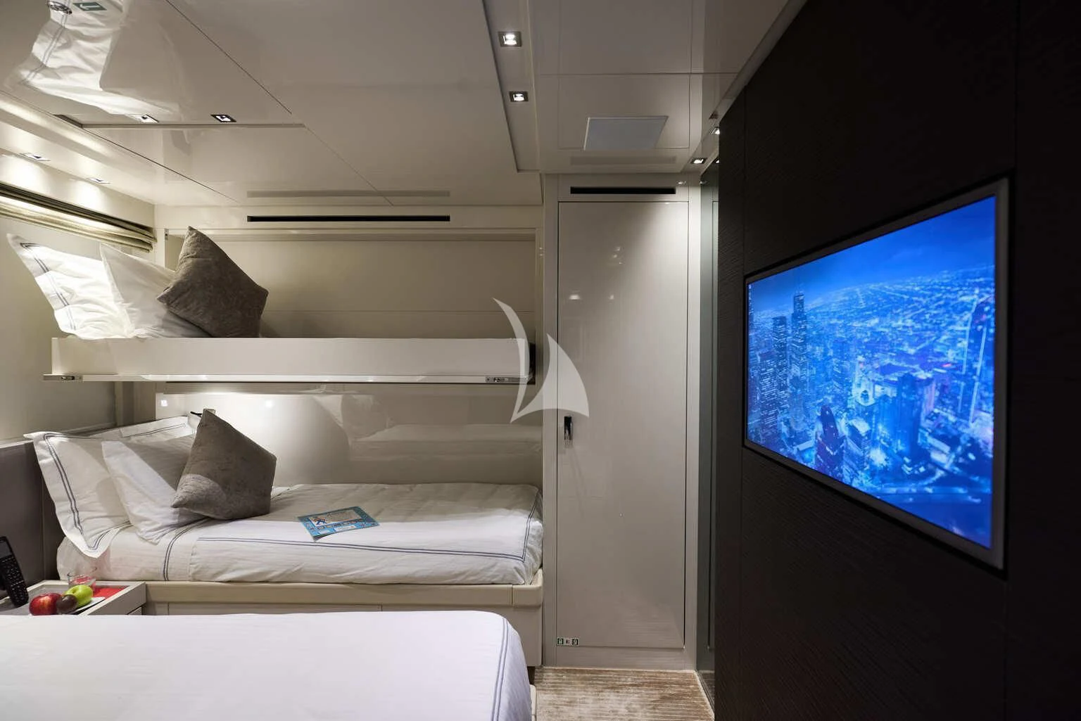 a bed with a tv on the wall aboard DE ZEUS Yacht for Sale