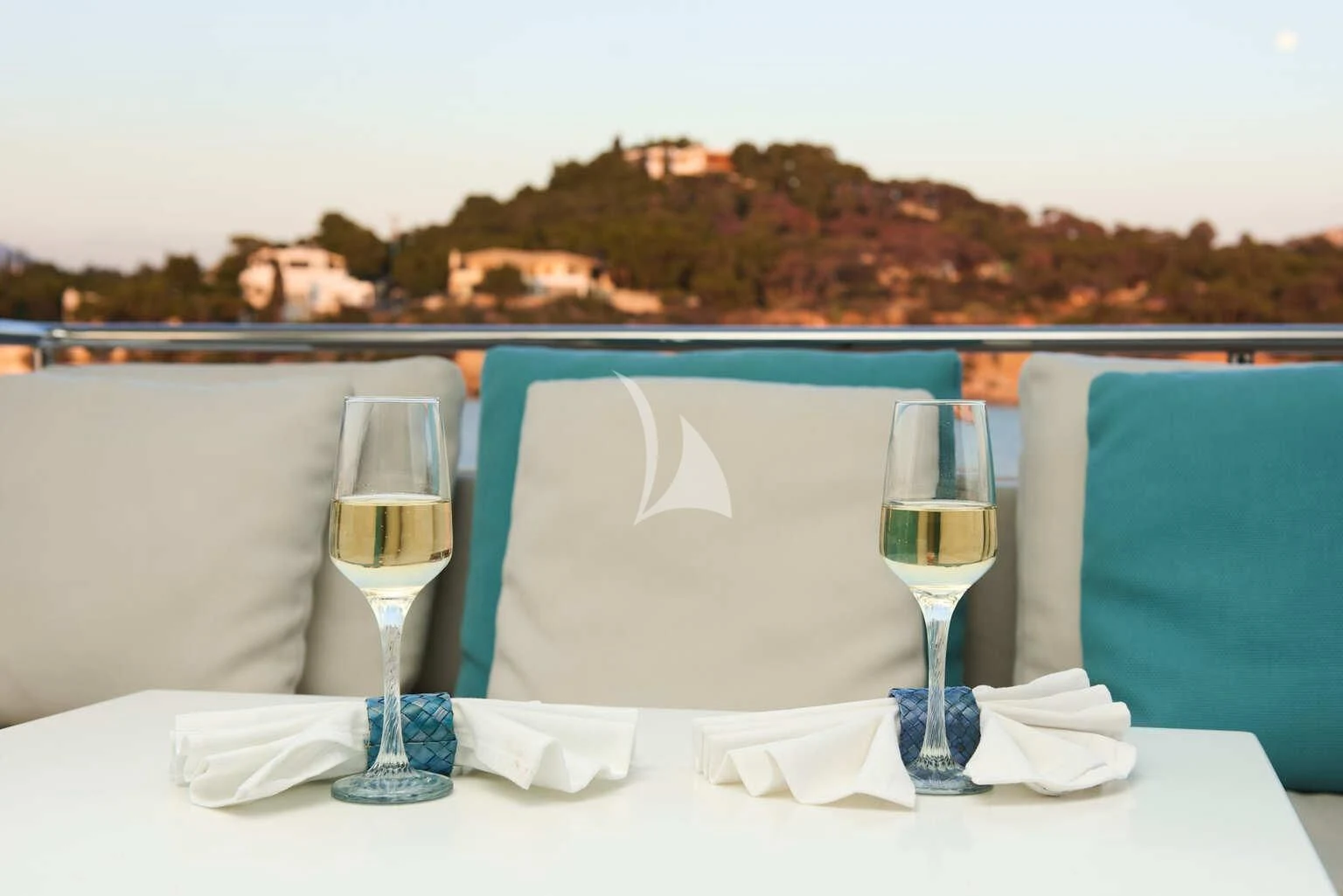 a table with glasses and napkins on it aboard DE ZEUS Yacht for Sale