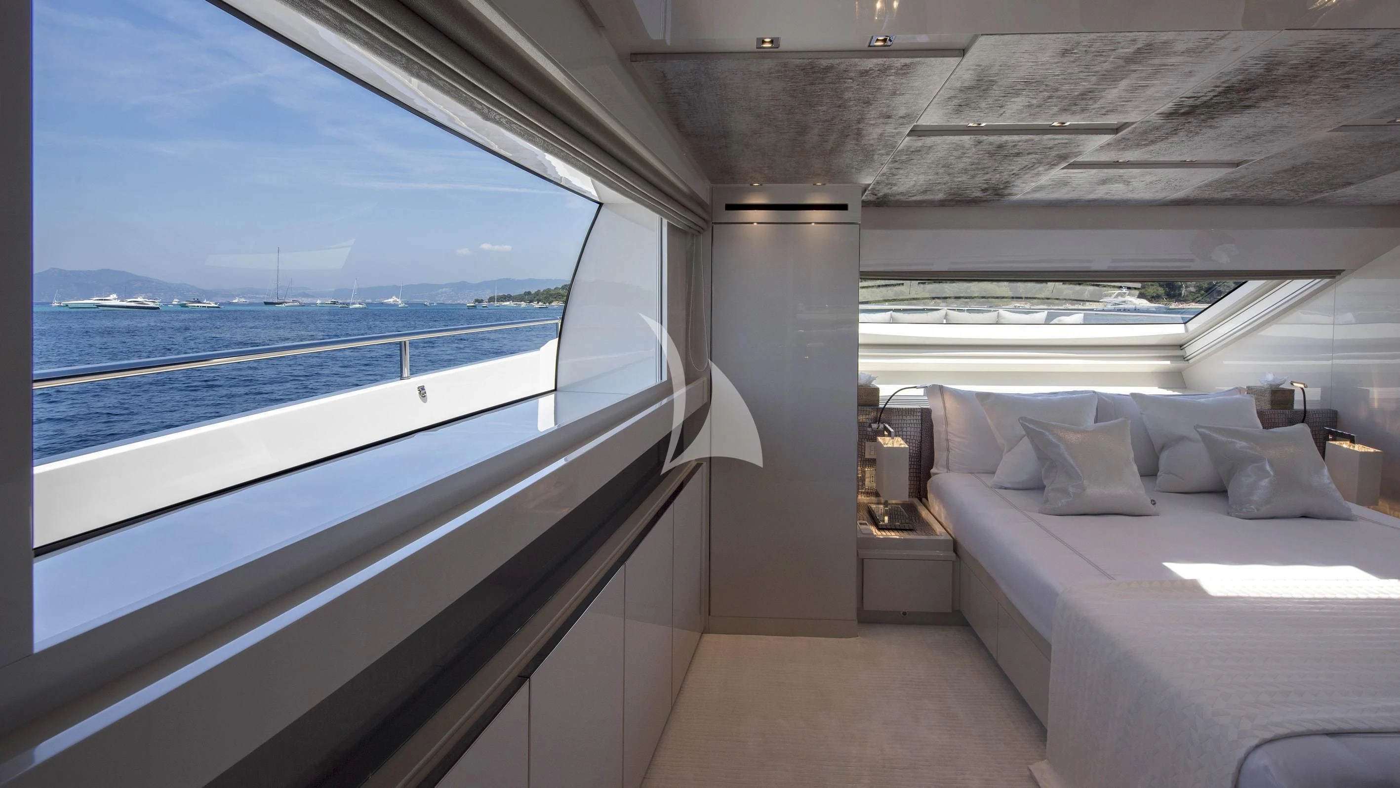 a room with a bed and a large window aboard DE ZEUS Yacht for Sale