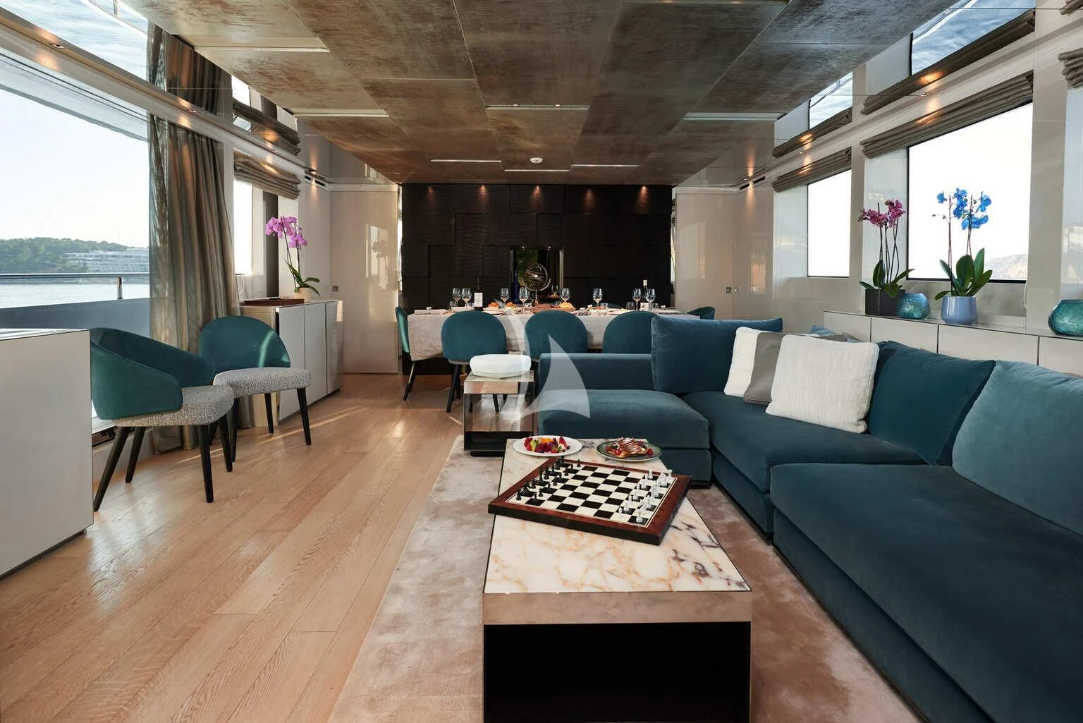 a living room with a couch and a coffee table aboard DE ZEUS Yacht for Sale