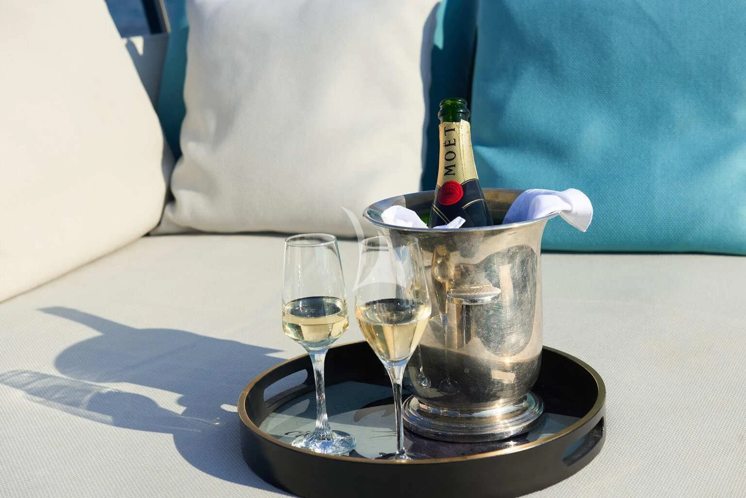a bottle of champagne and glasses aboard DE ZEUS Yacht for Sale