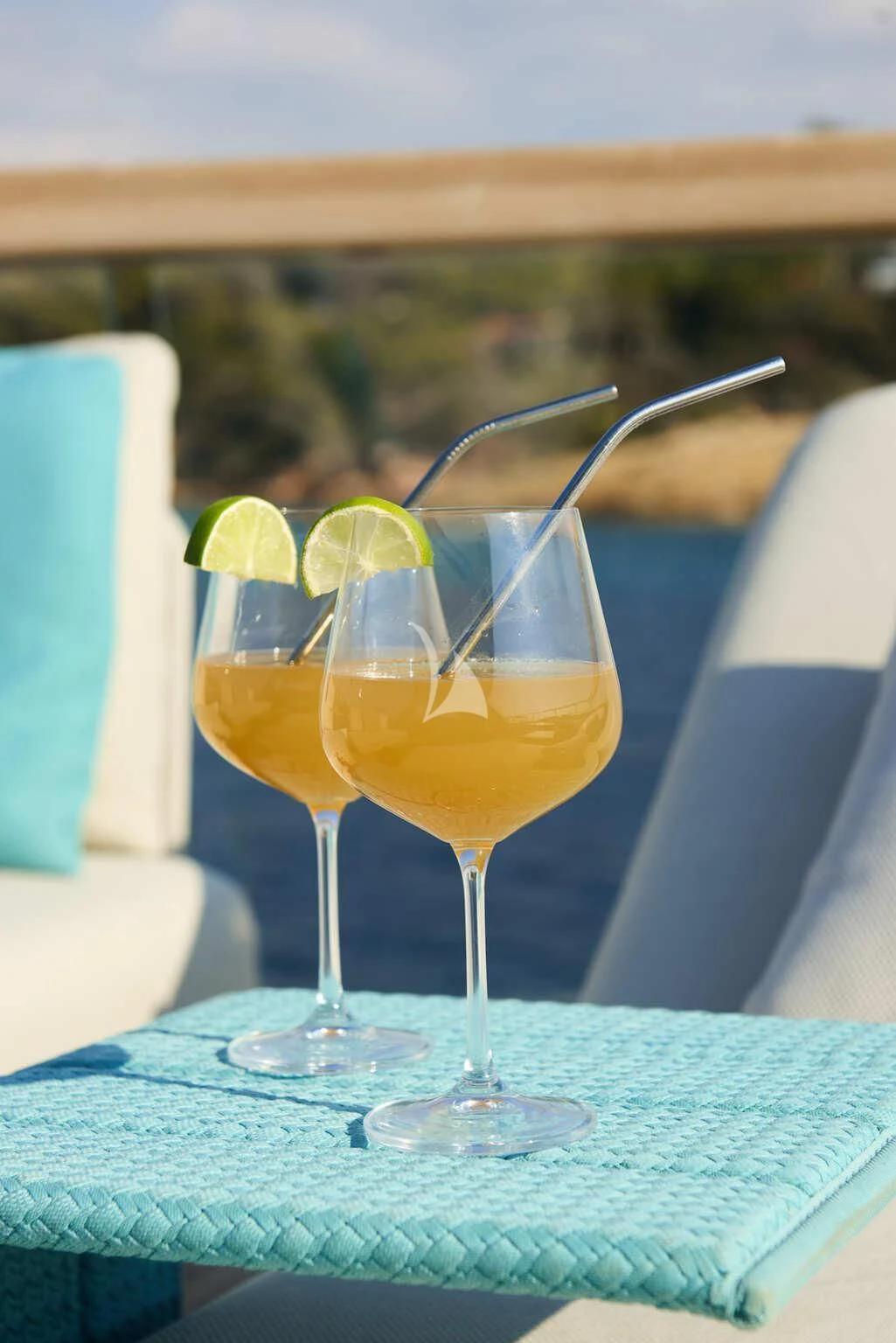 a couple of glasses with drinks in them aboard DE ZEUS Yacht for Sale
