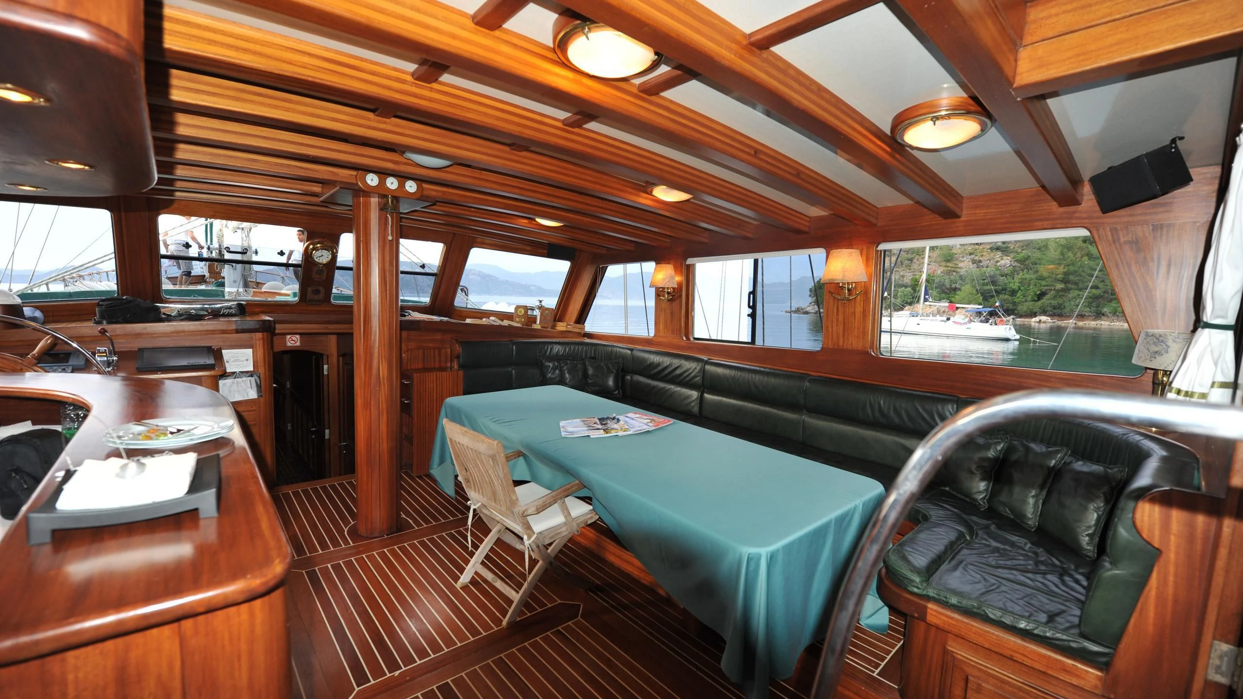 a room with a pool table and chairs aboard CARPE DIEM 1 Yacht for Sale