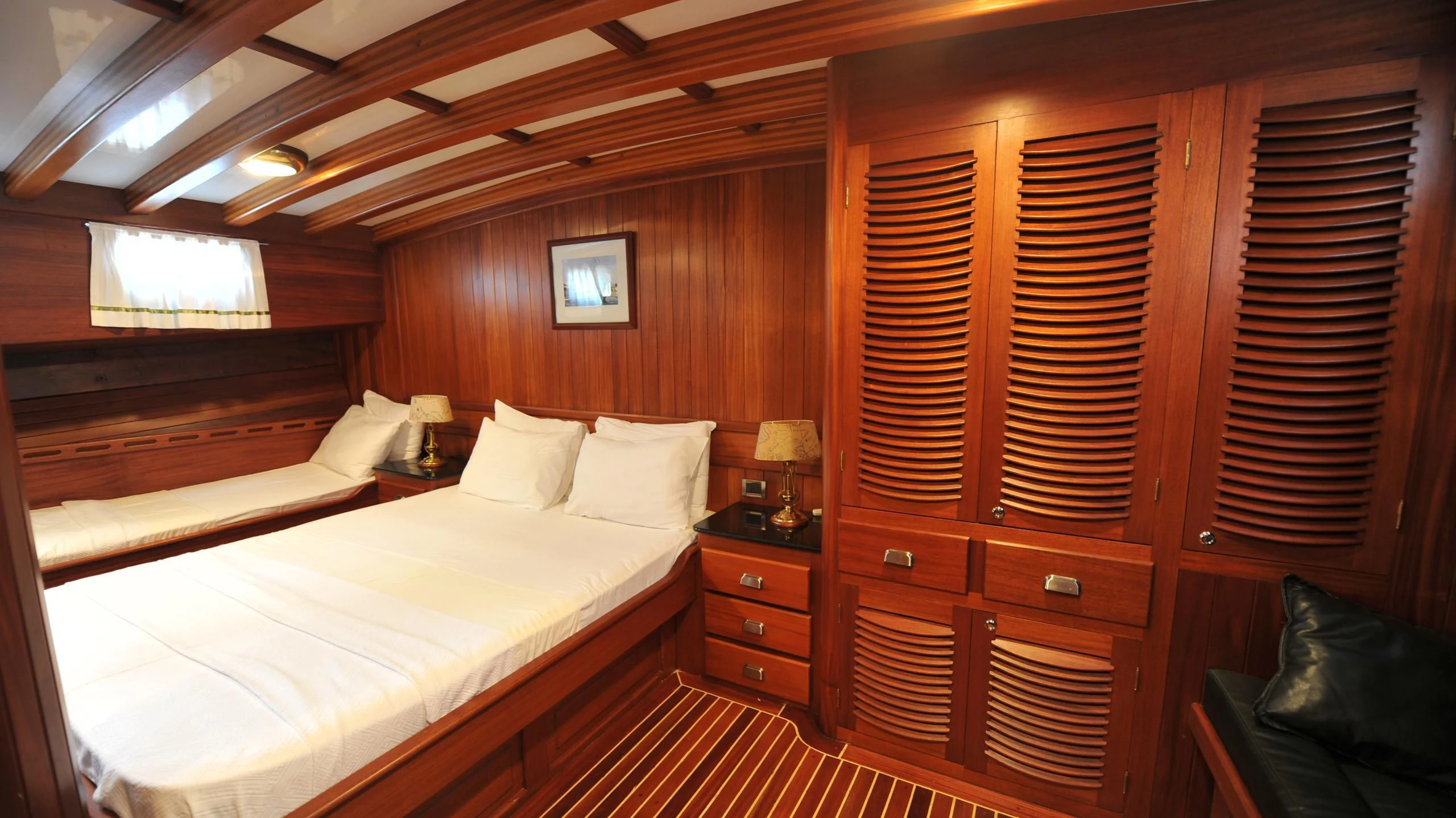 a room with two beds aboard CARPE DIEM 1 Yacht for Sale
