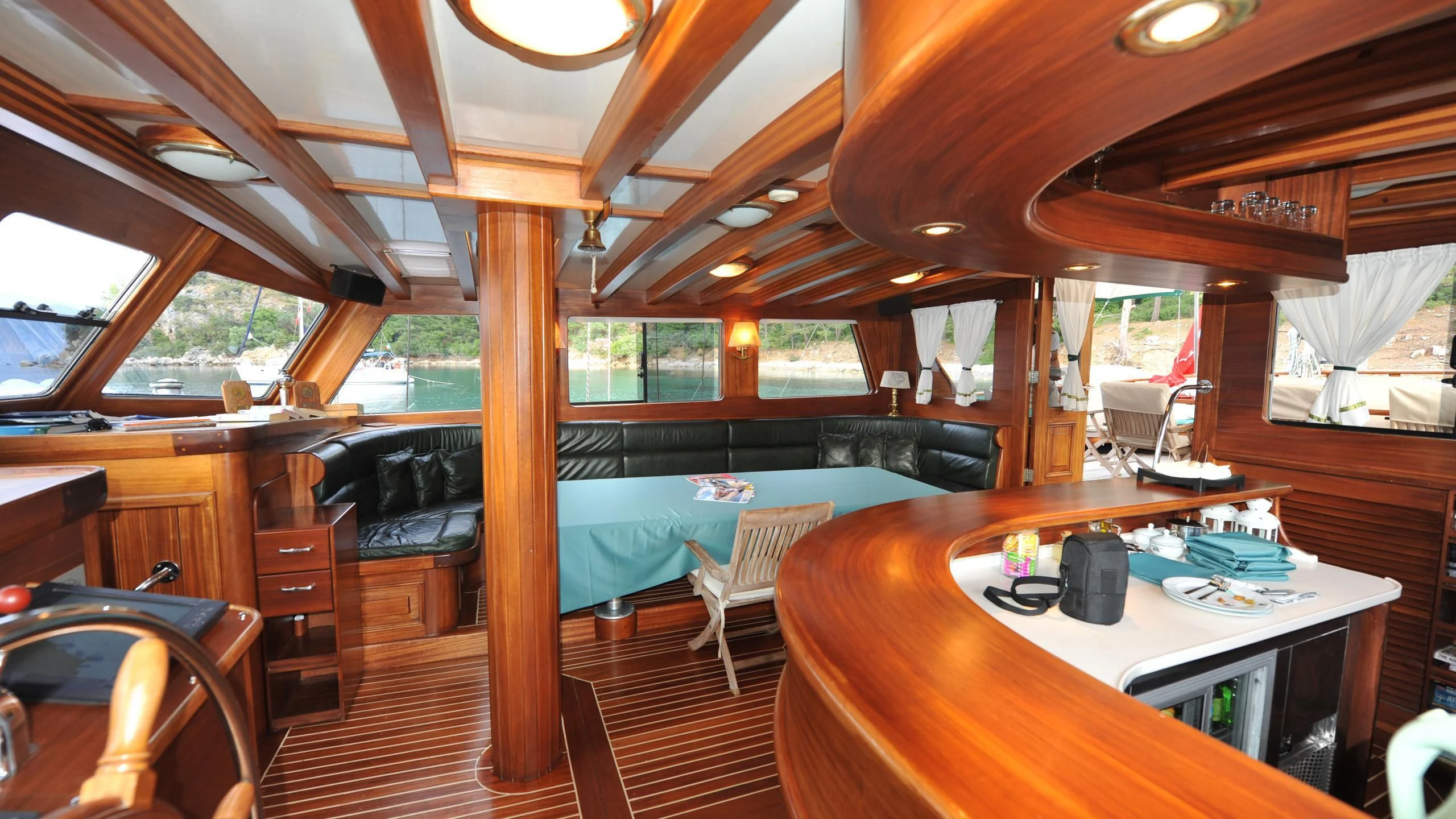 a boat with a table and chairs aboard CARPE DIEM 1 Yacht for Sale