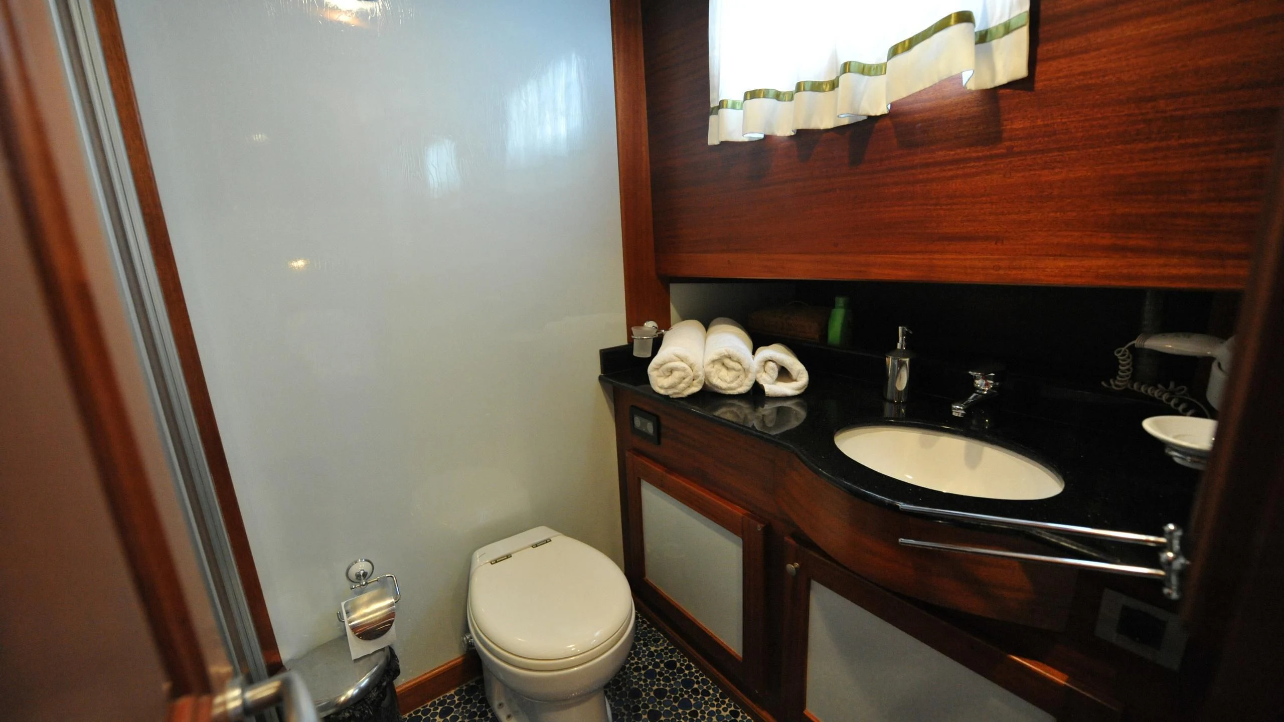 a bathroom with a sink and toilet aboard CARPE DIEM 1 Yacht for Sale