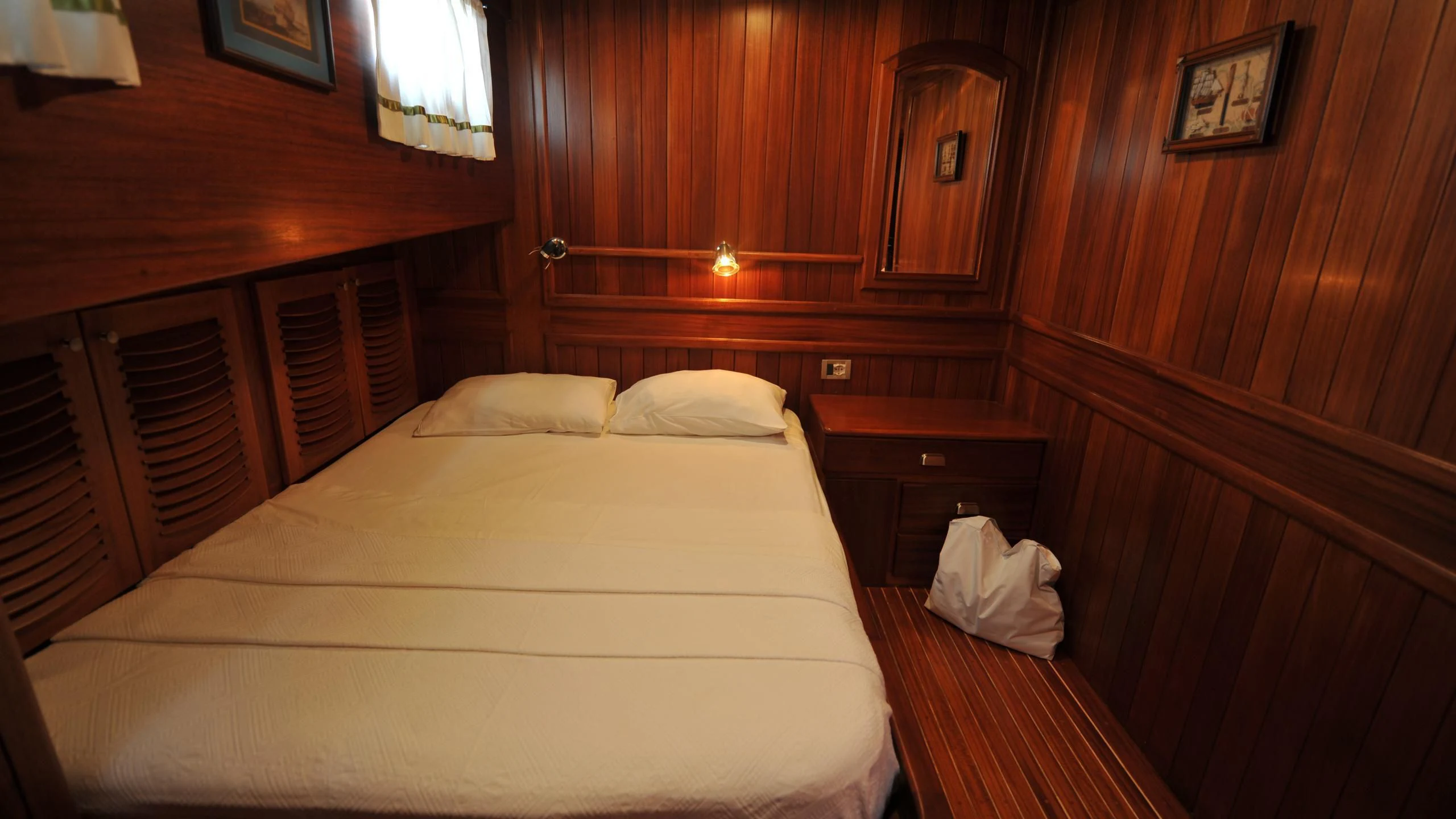 a bed in a room aboard CARPE DIEM 1 Yacht for Sale
