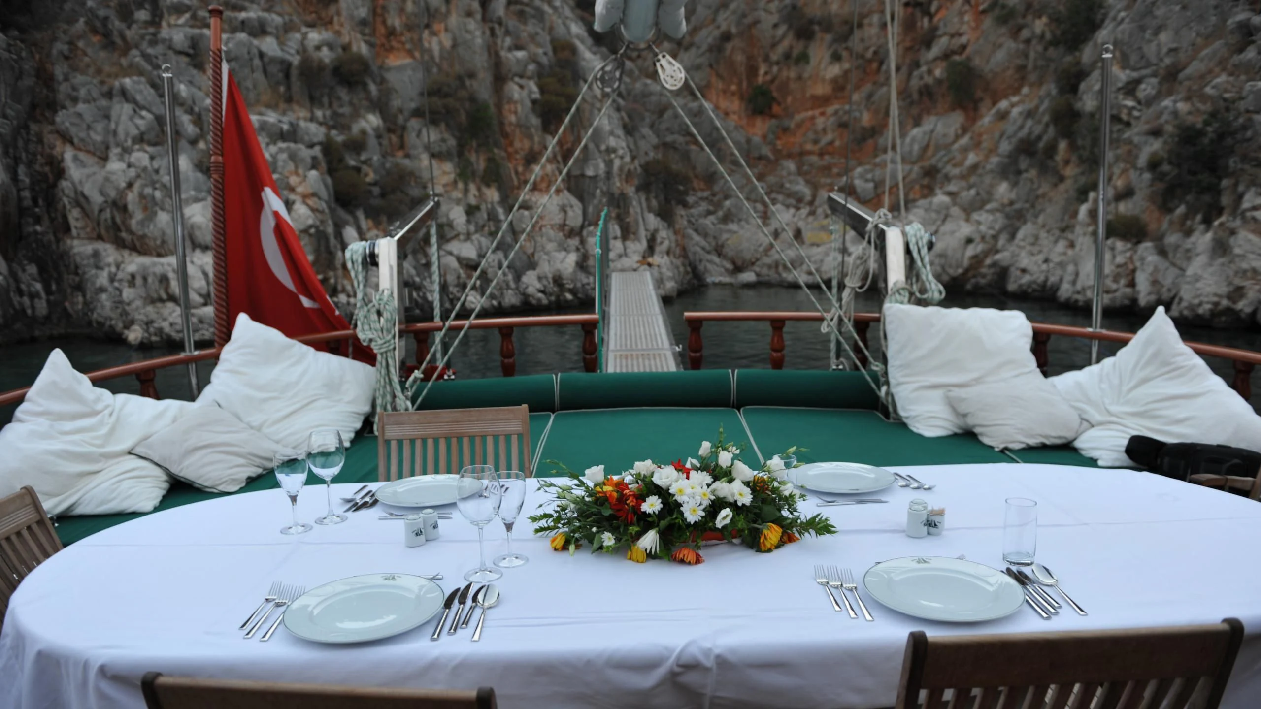 a table set with place settings aboard CARPE DIEM 1 Yacht for Sale