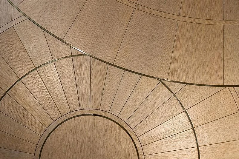 a circular object on a wooden surface aboard NENINKA Yacht for Sale