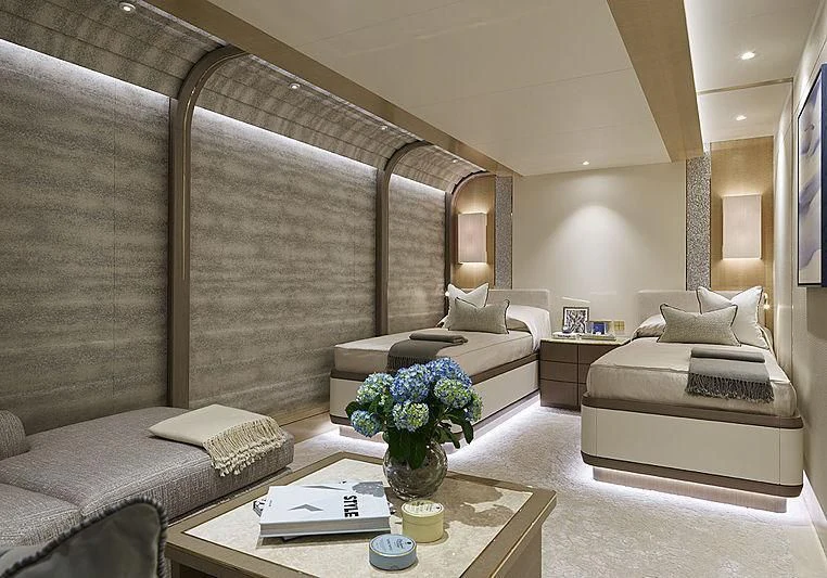 a living room with a large staircase aboard NENINKA Yacht for Sale