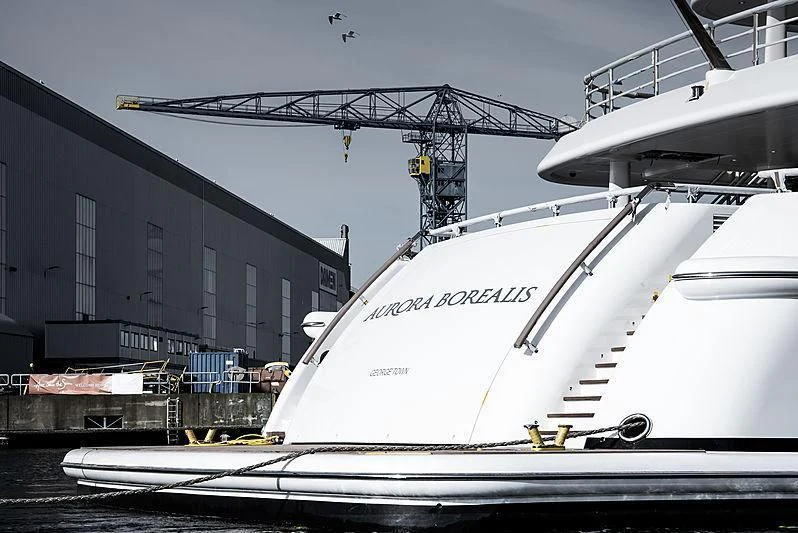 a large white boat in a harbor aboard NENINKA Yacht for Sale