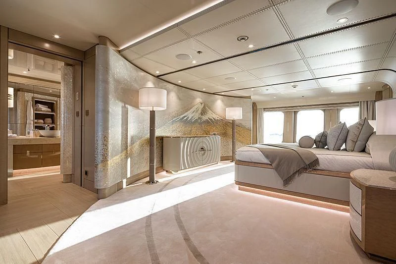 a large bedroom with a large mirror aboard NENINKA Yacht for Sale