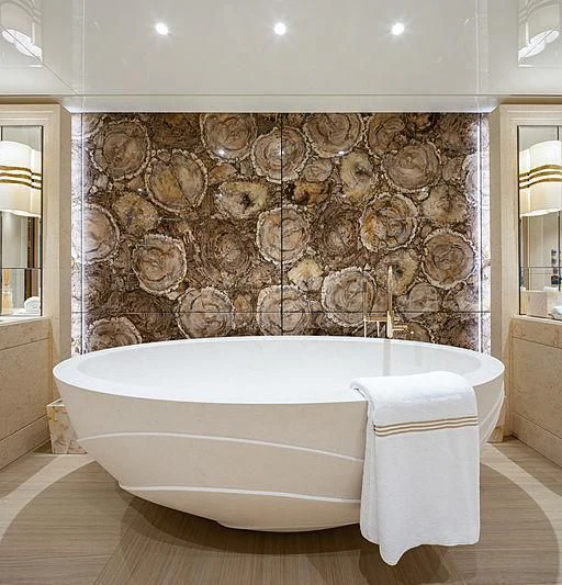 a bathroom with a stone wall aboard NENINKA Yacht for Sale