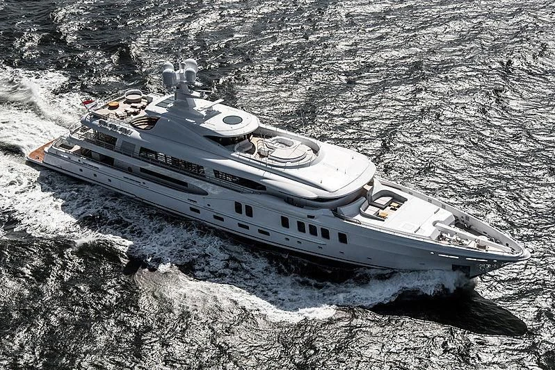 a military tank driving on a rocky hill aboard NENINKA Yacht for Sale