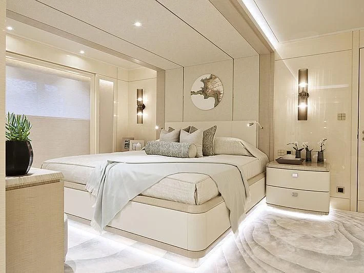 a large white bed in a room aboard NENINKA Yacht for Sale