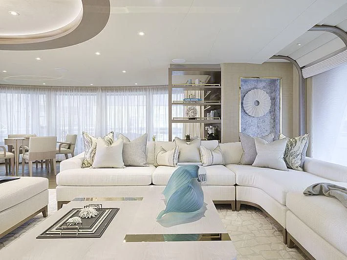 a living room with a white couch aboard NENINKA Yacht for Sale