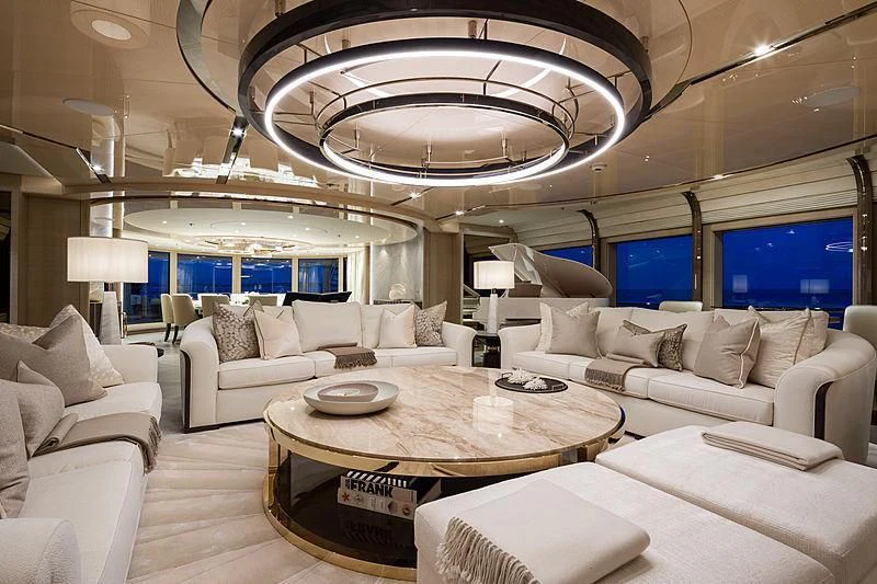 a living room with a large chandelier aboard NENINKA Yacht for Sale