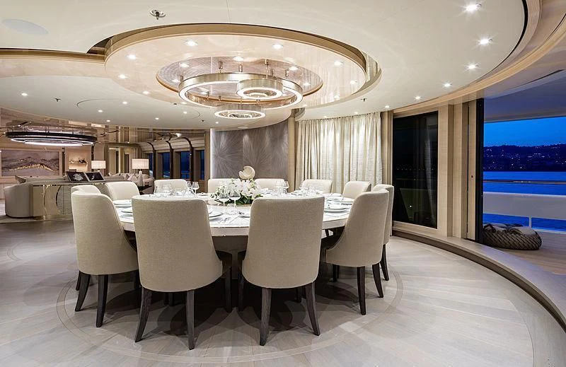 a large room with a table and chairs aboard NENINKA Yacht for Sale