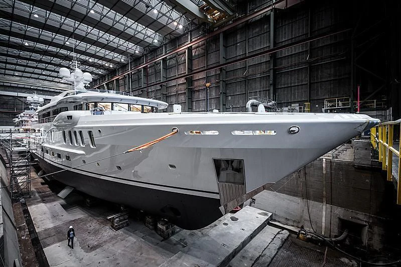 a large white yacht in a warehouse aboard NENINKA Yacht for Sale