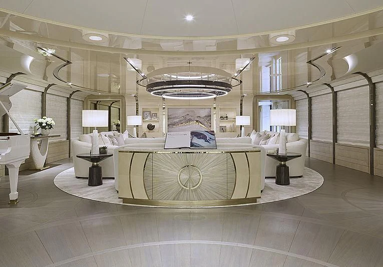 a large room with a large round table and a chandelier aboard NENINKA Yacht for Sale