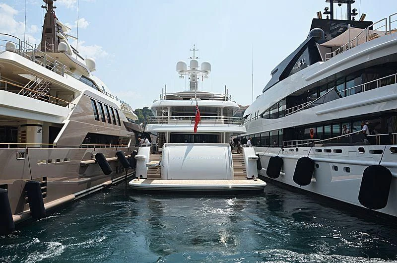 several large boats in a harbor aboard NENINKA Yacht for Sale