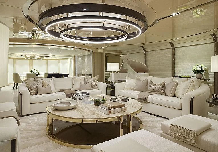 a large living room with a chandelier aboard NENINKA Yacht for Sale